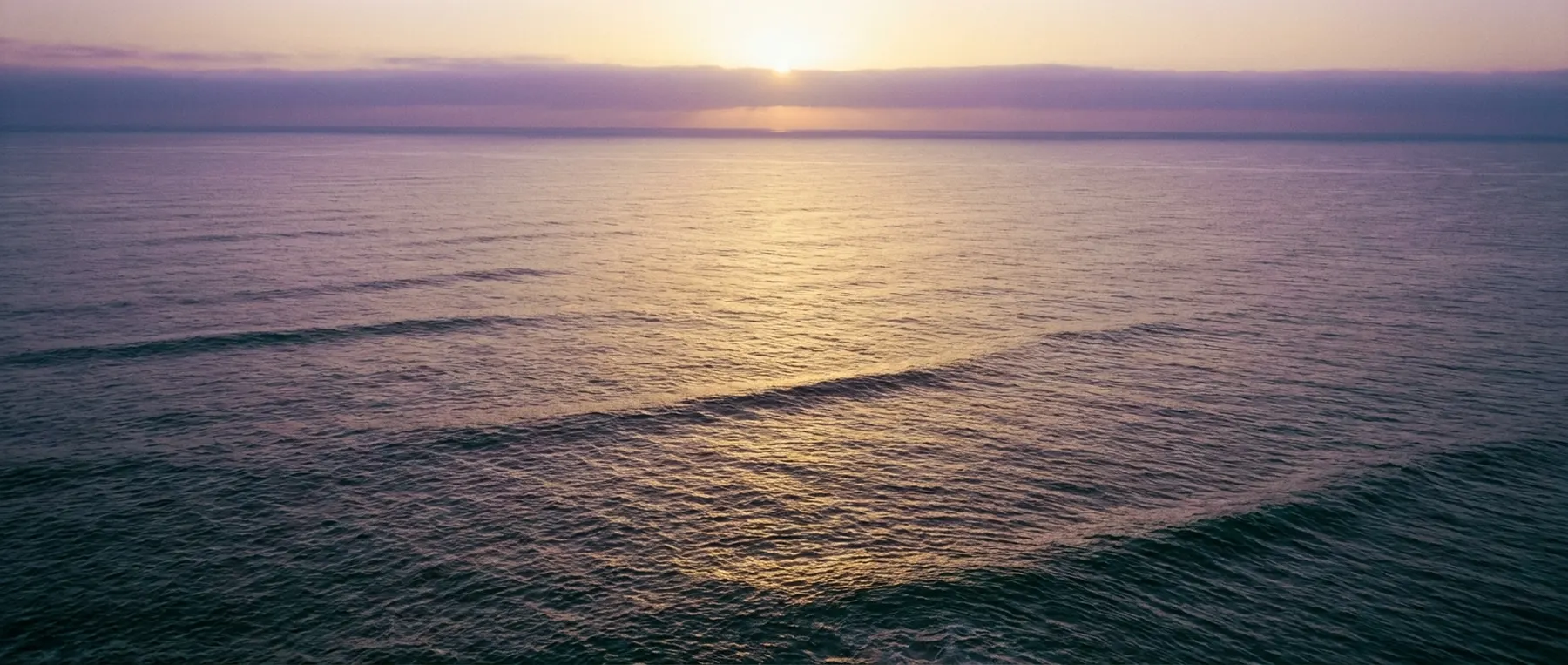 Calm open ocean at golden hour